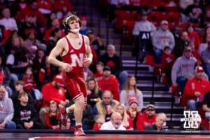 At 125, no. 27 Nebraska Cornhusker Trever Anderson runs out on the matt to take on Northern Iowa Panther Alan Koehler during a college wrestling match. Koehler won by decision over Anderson 5-2 on Saturday, Jan. 3, 2026, in Lincoln, Nebraska. Photo by John S. Peterson.