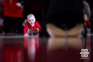 Baby racing to his mom in the annual baby race during a college women’s basketball game between the Nebraska Cornhuskers and the Purdue Boilermakers on Sunday, Jan. 4, 2026, in Lincoln, Nebraska. Photo by John S. Peterson.