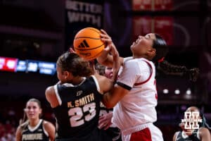 Nebraska Cornhusker forward Amiah Hargrove (33) fights for the rebound against Purdue Boilermaker guard Kiki Smith (23) during a college women’s basketball game on Sunday, Jan. 4, 2026, in Lincoln, Nebraska. Photo by John S. Peterson.