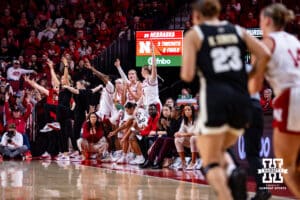 Nebraska Cornhuskers bench mob celebrates the three-point shot by Callin Hake against Purdue Boilermaker guard Kiki Smith (23) during a college women’s basketball game on Sunday, Jan. 4, 2026, in Lincoln, Nebraska. Photo by John S. Peterson.