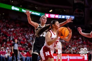 Nebraska Cornhusker guard Kennadi Williams (15) drives the baseline, making a pass to Callin Hake in the corner against the Purdue Boilermakers during a college women’s basketball game on Sunday, Jan. 4, 2026, in Lincoln, Nebraska. Photo by John S. Peterson.
