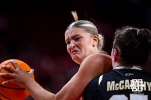 Nebraska Cornhusker forward Jessica Petrie (12) drives to the basket against Purdue Boilermaker forward Lana McCarthy (35) during a college women’s basketball game on Sunday, Jan. 4, 2026, in Lincoln, Nebraska. Photo by John S. Peterson.