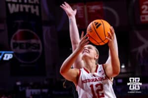 Nebraska Cornhusker forward Jessica Petrie (12) makes a lay up against Purdue Boilermaker guard Kiki Smith (23) during a college women’s basketball game on Sunday, Jan. 4, 2026, in Lincoln, Nebraska. Photo by John S. Peterson.