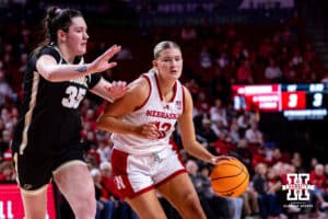 Nebraska Cornhusker forward Jessica Petrie (12) dribbles the ball against Purdue Boilermaker forward Lana McCarthy (35) during a college women’s basketball game on Sunday, Jan. 4, 2026, in Lincoln, Nebraska. Photo by John S. Peterson.