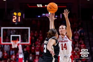 Nebraska Cornhusker guard Callin Hake (14) makes a three-point shot against Purdue Boilermaker guard Kiki Smith (23) in the first quarter during a college women’s basketball game on Sunday, Jan. 4, 2026, in Lincoln, Nebraska. Photo by John S. Peterson.