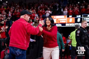Nebraska Cornhusker head coach Amy Williams shakes hands with a fan coming out to the court to take on the Purdue Boilermakers during a college women’s basketball game on Sunday, Jan. 4, 2026, in Lincoln, Nebraska. Photo by John S. Peterson.