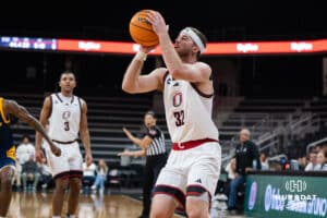 Omaha Maverick Tony Osburn (32) shoots a three pointer during a basketball game against Kansas City on Saturday, Jan 3, 2026, in Omaha, Nebraska. Photo by Brandon Tiedemann.