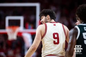 Nebraska Cornhusker forward Berke Buyuktuncel (9) smiles reacting to the action on the court against the Michigan State Spartans in the second half during a college basketball game on Friday, Jan. 2, 2026, in Lincoln, Nebraska. Photo by John S. Peterson.