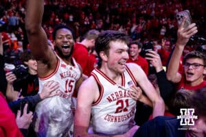 Nebraska Cornhusker forward Pryce Sandfort (21) and forward Jared Garcia (15) caught in the court-storming after the close win over Michigan State Spartans during a college basketball game on Friday, Jan. 2, 2026, in Lincoln, Nebraska. Photo by John S. Peterson.
