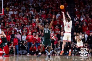 Nebraska Cornhusker forward Braden Frager (5) makes a three-point shot against Michigan State Spartan forward Coen Carr (55) in the second half during a college basketball game on Friday, Jan. 2, 2026, in Lincoln, Nebraska. Photo by John S. Peterson.