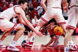 Michigan State Spartan forward Jaxon Kohler (0) reaches for a loose ball between both his legs and Nebraska Cornhusker Rienk Mast's legs in the second half during a college basketball game on Friday, Jan. 2, 2026, in Lincoln, Nebraska. Photo by John S. Peterson.