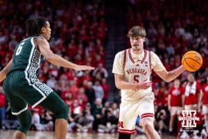 Nebraska Cornhusker forward Braden Frager (5) makes a pass against Michigan State Spartan forward Jordan Scott (6) during a college basketball game on Friday, Jan. 2, 2026, in Lincoln, Nebraska. Photo by John S. Peterson.