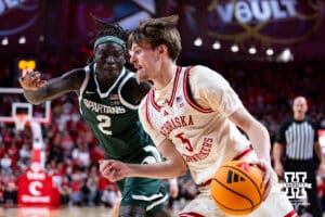 Nebraska Cornhusker forward Braden Frager (5) dribbles the baseline against Michigan State Spartan guard Kur Teng (2) in the first half during a college basketball game on Friday, Jan. 2, 2026, in Lincoln, Nebraska. Photo by John S. Peterson.