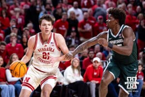Nebraska Cornhusker forward Pryce Sandfort (21) dribbles the ball against Michigan State Spartan forward Coen Carr (55) in the first half during a college basketball game on Friday, Jan. 2, 2026, in Lincoln, Nebraska. Photo by John S. Peterson.