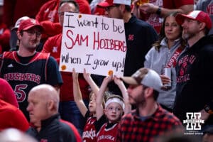 Nebraska Cornhusker fans holding up a sign against the Michigan State Spartans during a college basketball game on Friday, Jan. 2, 2026, in Lincoln, Nebraska. Photo by John S. Peterson.