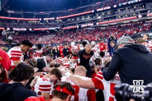 Nebraska Cornhuskers and Utah Utes gather for a prayer after the game led by coach Ron Brown during the Las Vegas Bowl game on Wednesday, Dec. 31, 2025, in Las Vegas, NV. Photo by John S. Peterson.