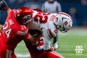 Nebraska Cornhusker running back Isaiah Mozee (22) goes through Utah Ute linebacker Moroni Anae (24) in the second half during the Las Vegas Bowl game on Wednesday, Dec. 31, 2025, in Las Vegas, NV. Photo by John S. Peterson.