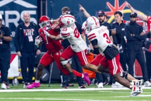 Nebraska Cornhusker defensive back Caleb Benning (23) tackles Utah Ute running back Wayshawn Parker (1) during the Las Vegas Bowl game on Wednesday, Dec. 31, 2025, in Las Vegas, NV. Photo by John S. Peterson.