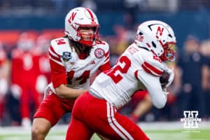 Nebraska Cornhusker quarterback TJ Lateef (14) hands the ball off to running back Isaiah Mozee (22) during the Las Vegas Bowl game on Wednesday, Dec. 31, 2025, in Las Vegas, NV. Photo by John S. Peterson.
