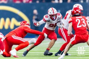 Nebraska Cornhusker running back Isaiah Mozee (22) runs with the ball against Utah Ute linebacker Levani Damuni (3) in the first quarter during the Las Vegas Bowl game on Wednesday, Dec. 31, 2025, in Las Vegas, NV. Photo by John S. Peterson.