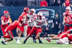 Nebraska Cornhusker running back Mekhi Nelson (35) runs with the ball against Utah Ute safety Tao Johnson (5) in the first quarter during the Las Vegas Bowl game on Wednesday, Dec. 31, 2025, in Las Vegas, NV. Photo by John S. Peterson.