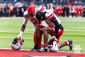 Nebraska Cornhusker defensive back Mario Buford (31) and defensive back Marques Buford Jr. (3) kneel down for a prayer before taking on the Utah Utes during the Las Vegas Bowl game on Wednesday, Dec. 31, 2025, in Las Vegas, NV. Photo by John S. Peterson.