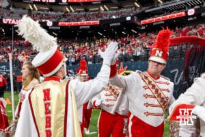 Nebraska Cornhuskers marching band drum major giving high fives before performing per-game during the Las Vegas Bowl game, Utah Utes on Wednesday, Dec. 31, 2025, in Las Vegas, NV. Photo by John S. Peterson.