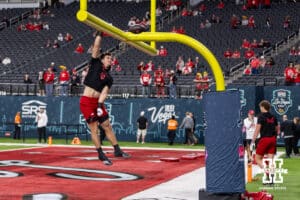 Nebraska Cornhusker tight end Heinrich Haarberg (10) dunks the ball over the goal post before taking on the Utah Utes during the Las Vegas Bowl game on Wednesday, Dec. 31, 2025, in Las Vegas, NV. Photo by John S. Peterson.