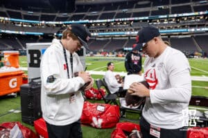 Nebraska Cornhuskers ball boys clean the footballs gettiing ready to take on theUtah Utes during the Las Vegas Bowl game on Wednesday, Dec. 31, 2025, in Las Vegas, NV. Photo by John S. Peterson.