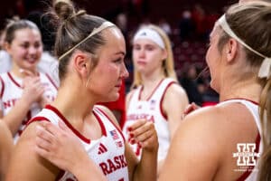 Nebraska Cornhusker guard Callin Hake (14) tears up with her teammates on senior night during a women’s basketball game on Saturday, Feb. 28, 2026, in Lincoln, Nebraska. Photo by John S. Peterson.