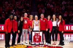 Nebraska Cornhusker guard Callin Hake (14) poses with family and coaches after the win over the Rutgers Scarlet Knights during a women’s basketball game on Saturday, Feb. 28, 2026, in Lincoln, Nebraska. Photo by John S. Peterson.