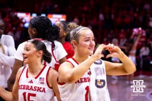 Nebraska Cornhusker guard Callin Hake (14) makes a heart for the fans on senior night for her last time playing at home during a women’s basketball game against the Rutgers Scarlet Knights on Saturday, Feb. 28, 2026, in Lincoln, Nebraska. Photo by John S. Peterson.