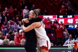 Nebraska Cornhusker guard Callin Hake (14) gives head coach Amy Williams a hug when coming out of the game at the end of the fourth quarter on senior night against the Rutgers Scarlet Knights during a women’s basketball game on Saturday, Feb. 28, 2026, in Lincoln, Nebraska. Photo by John S. Peterson.
