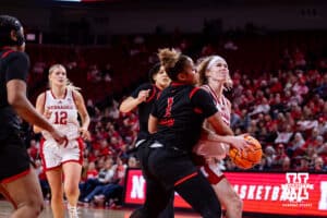 Nebraska Cornhusker guard Britt Prince (23) is fouled by Rutgers Scarlet Knight guard Lauryn Swann (1) in the third quarter during a women’s basketball game on Saturday, Feb. 28, 2026, in Lincoln, Nebraska. Photo by John S. Peterson.
