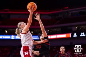 Nebraska Cornhusker forward Jessica Petrie (12) makes a lay up against Rutgers Scarlet Knight center Imani Lester (30) in the third quarter during a women’s basketball game on Saturday, Feb. 28, 2026, in Lincoln, Nebraska. Photo by John S. Peterson.