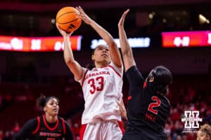 Nebraska Cornhusker forward Amiah Hargrove (33) makes a lay up against Rutgers Scarlet Knight guard Kaylah Ivey (2) in the third quarter during a women’s basketball game on Saturday, Feb. 28, 2026, in Lincoln, Nebraska. Photo by John S. Peterson.