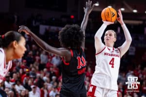 Nebraska Cornhusker forward Petra Bozan (4) makes a three-point basket against Rutgers Scarlet Knight forward Nene Ndiaye (10) in the first quarter during a women’s basketball game on Saturday, Feb. 28, 2026, in Lincoln, Nebraska. Photo by John S. Peterson.
