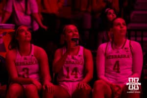 Nebraska Cornhusker guard Callin Hake (14) and Logan Nissley watch the hype video before the introduction during a women’s basketball game against the Rutgers Scarlet Knights on Saturday, Feb. 28, 2026, in Lincoln, Nebraska. Photo by John S. Peterson.