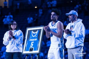 Creighton Bluejay Nik Graves (5) stands with family after a college basketball game against Providence on Feb 28, 2026, in Omaha, Nebraska. Photo by Brandon Tiedemann