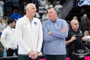 Creighton Bluejay head coach Greg McDermott and assistant coach Alan Huss talk after a college basketball game against Providence on Feb 28, 2026, in Omaha, Nebraska. Photo by Brandon Tiedemann