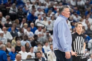 Creighton Bluejay head coach Greg McDermott smirks at a ref during a college basketball game against Providence on Feb 28, 2026, in Omaha, Nebraska. Photo by Brandon Tiedemann