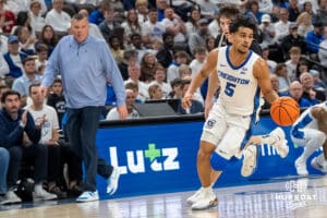 Creighton Bluejay Nik Graves (5) dribbles during a college basketball game against Providence on Feb 28, 2026, in Omaha, Nebraska. Photo by Brandon Tiedemann