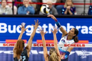 Omaha Supernovas Reagan Cooper (8) spikes the ball against Atlanta Vibe Khori Louis (22) and Averi Carlson (2) during a professional volleyball match on Thursday, Feb. 26, 2026, in Omaha, Nebraska. Photo by John S. Peterson.