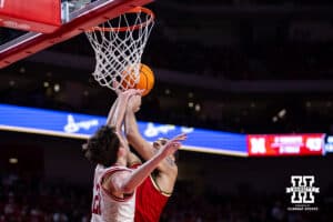 Nebraska Cornhusker forward Pryce Sandfort (21) blocks a shot from Maryland Terrapin center Collin Metcalf (45) in the second half during a college basketball game on Wednesday, Feb. 25, 2026, in Lincoln, Nebraska.
