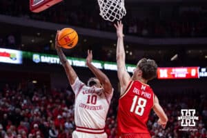 Nebraska Cornhusker guard Jamarques Lawrence (10) makes a lay up against Maryland Terrapin guard Guillermo del Pino (18) in the first half during a college basketball game on Wednesday, Feb. 25, 2026, in Lincoln, Nebraska.