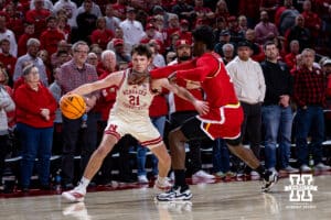 Nebraska Cornhusker forward Pryce Sandfort (21) drives to the basket against Maryland Terrapin forward Solomon Washington (9) in the first half during a college basketball game on Wednesday, Feb. 25, 2026, in Lincoln, Nebraska.