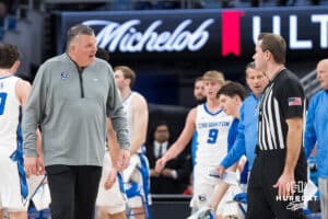 Creighton Bluejay head coach Greg McDermott talks to a ref during a college basketball game against DePaul on Feb 25, 2026, in Omaha, Nebraska. Photo by Brandon Tiedemann