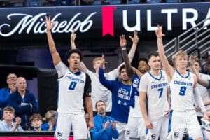 Creighton Bluejay bench celebrates during a college basketball game against DePaul on Feb 25, 2026, in Omaha, Nebraska. Photo by Brandon Tiedemann