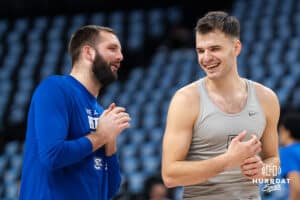 Creighton Bluejay Fedor Žugić (7) and assistant coach Mitch Ballock talk before a college basketball game against DePaul on Feb 25, 2026, in Omaha, Nebraska. Photo by Brandon Tiedemann