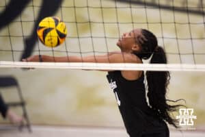 Nebraska Cornhusker Ryan Hunter (14) digs the ball against the Ottawa Braves during a college beach volleyball match on Monday, Feb. 23, 2026, in Lincoln, NE. Photo by John S. Peterson.